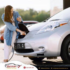 A woman and an electric car - GERMAN PRECISION